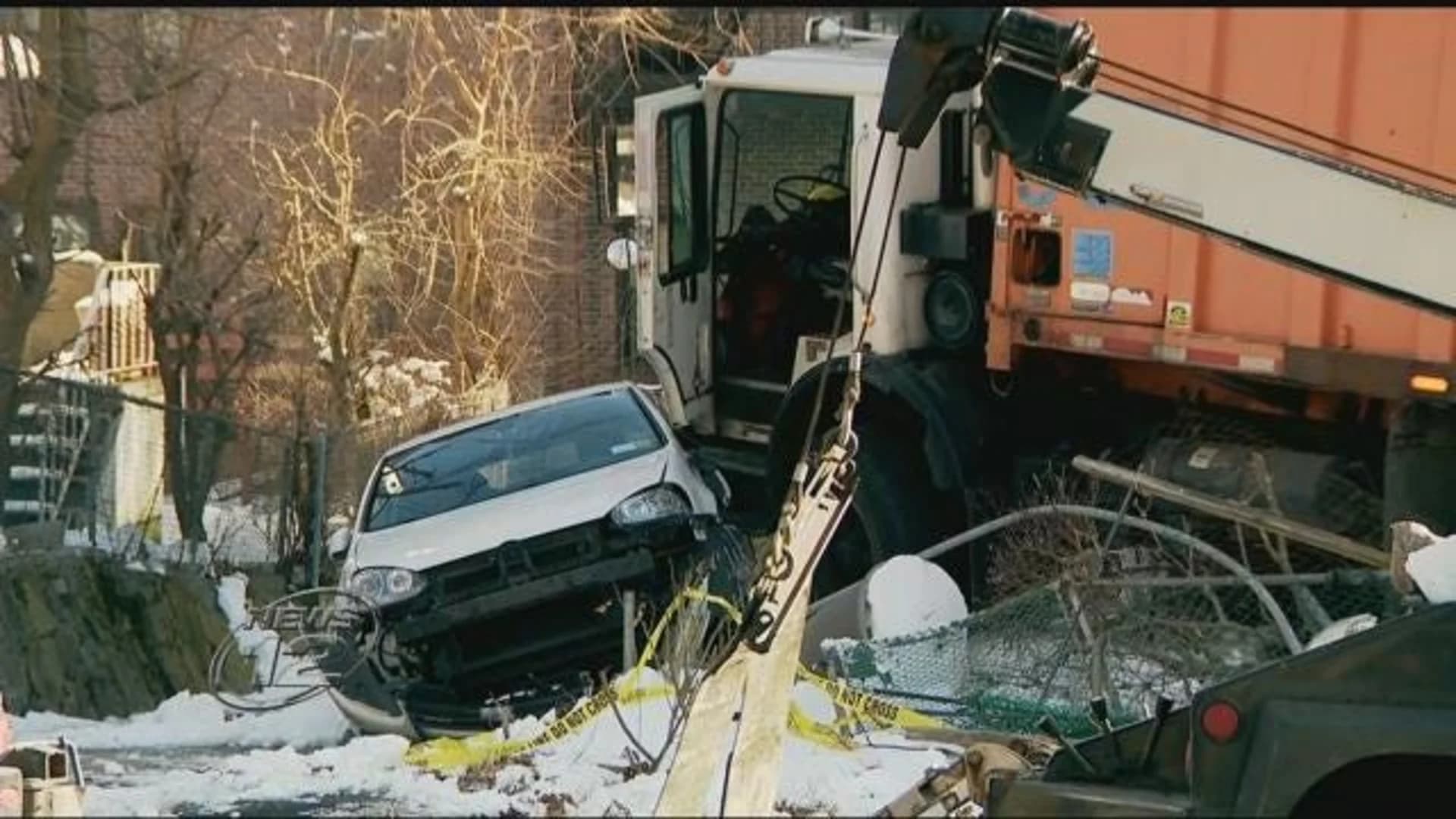 Runaway garbage truck slams into car and house in Mount Vernon