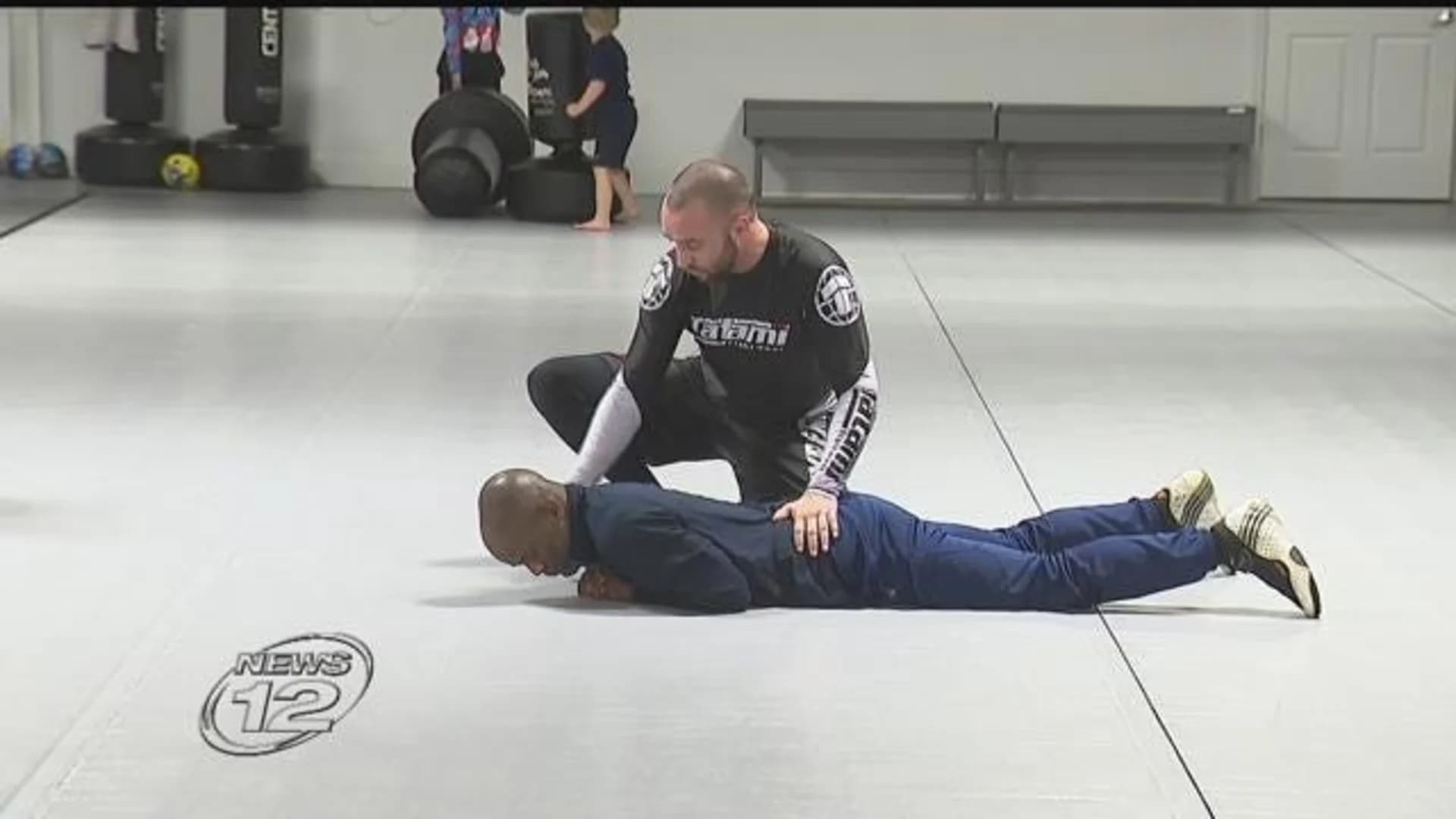 Mixed martial arts specialist teaches police officers to subdue suspects with little force