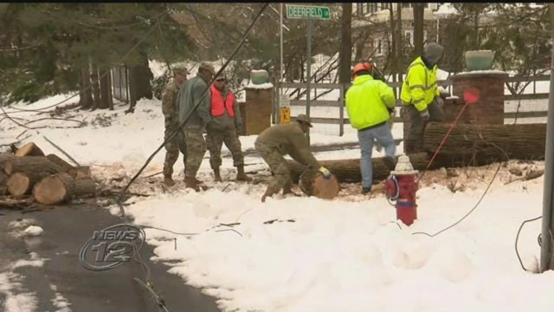 National Guardsmen deployed to help clear storm debris